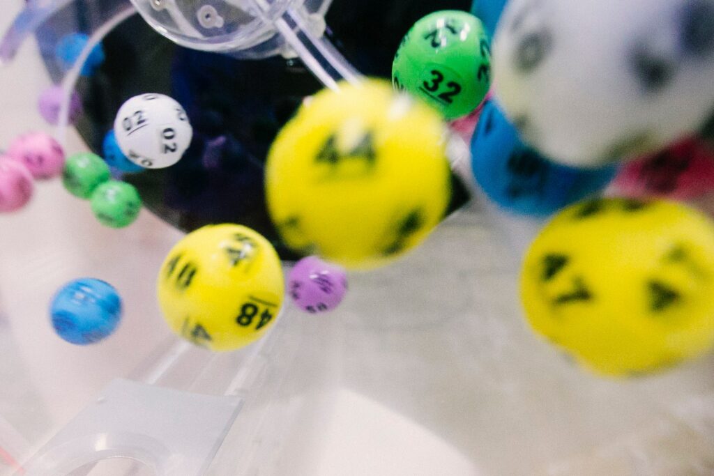A photo of colored plastic lottery balls with numbers on them.